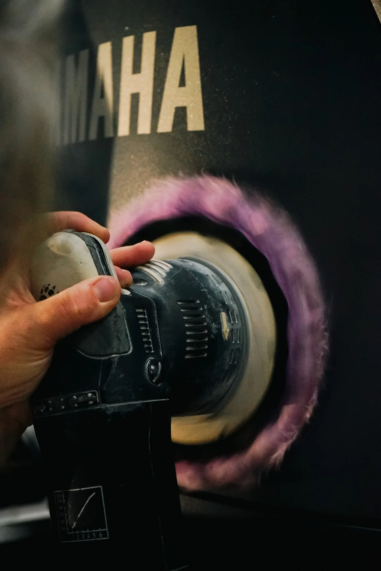 Machine buffing during a Yacht Armor PPF prep on a Yamaha outboard cowling