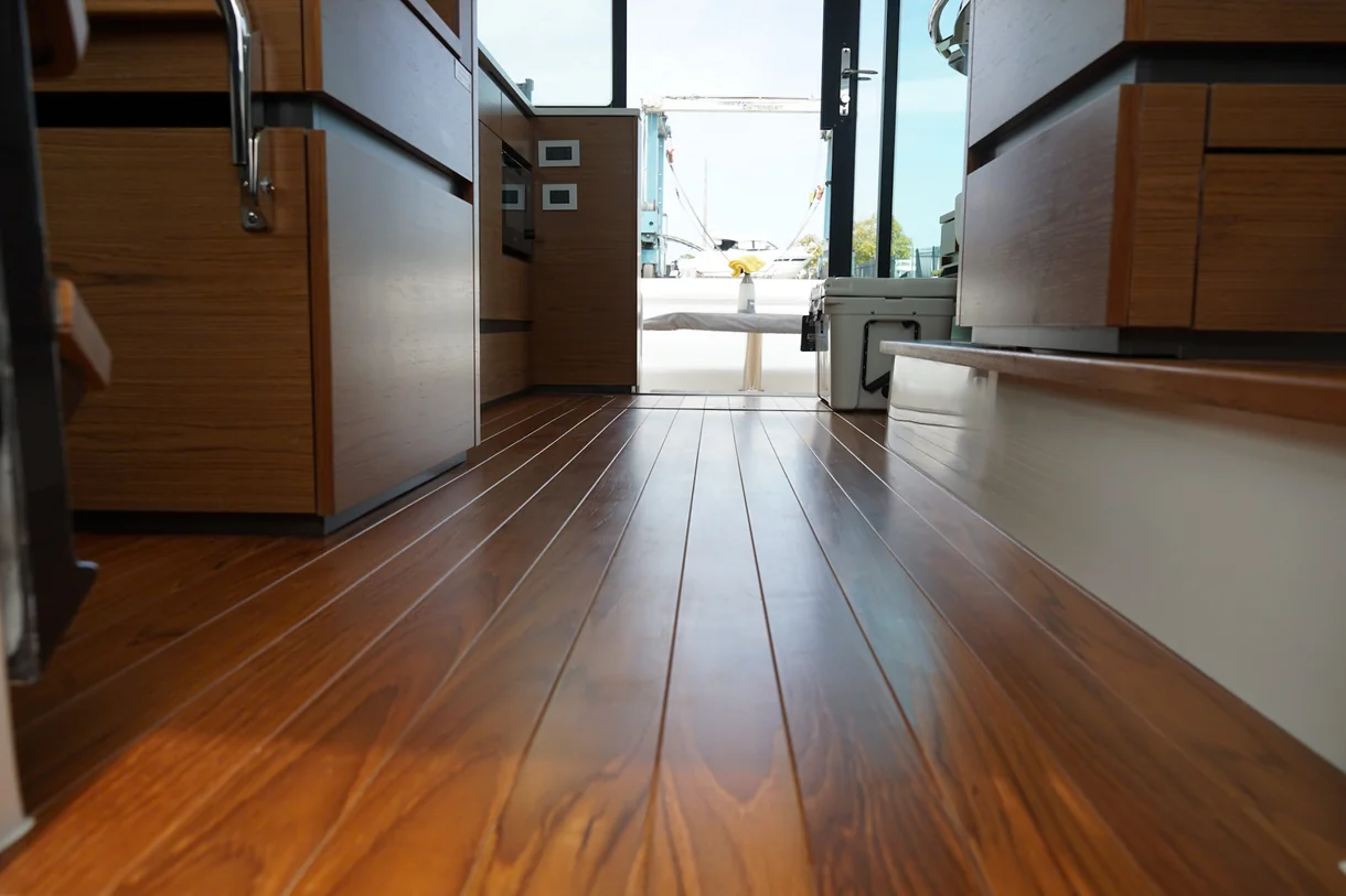 Below-deck wood sole checked for moisture and mildew