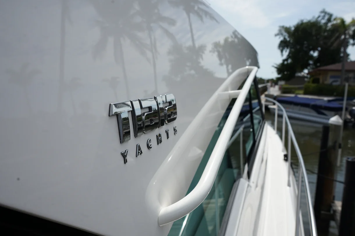 Showroom glossy finish and mirror reflection on marine gelcoat after ceramic coating in Sarasota FL