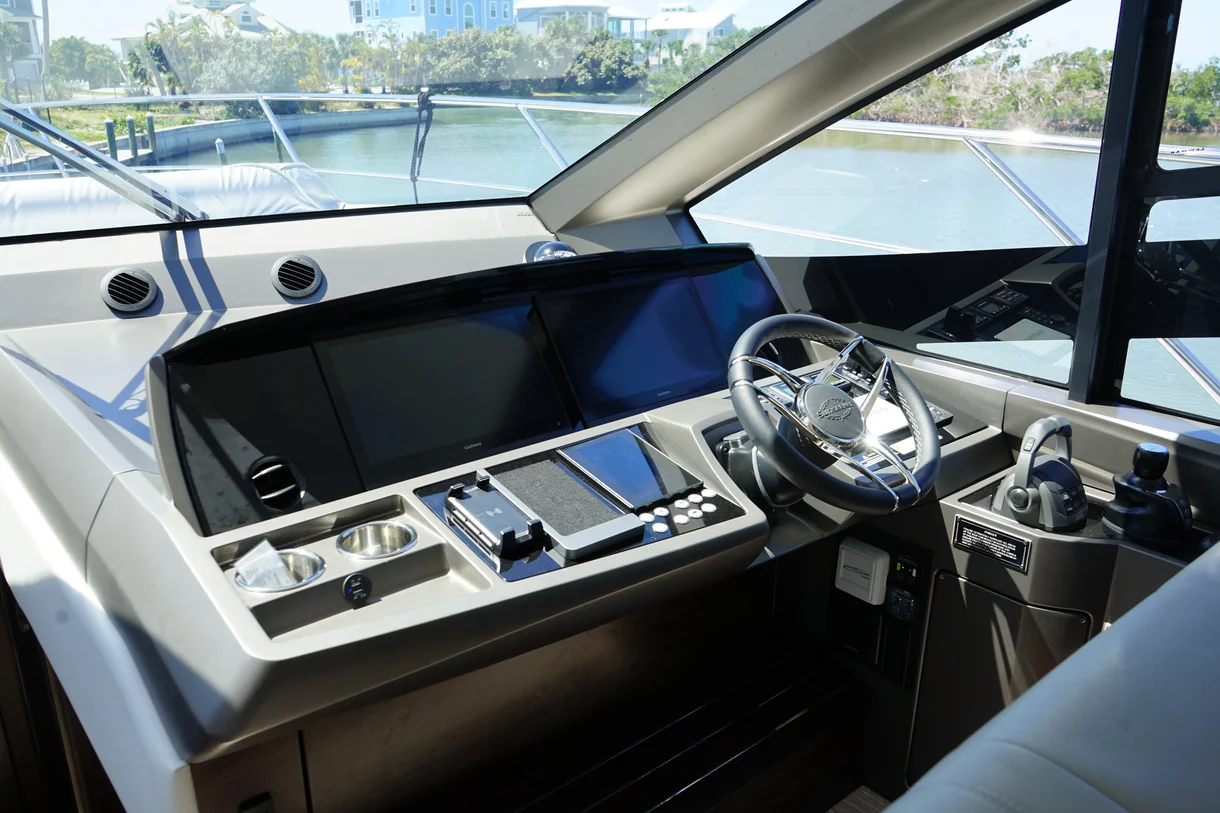 Helm electronics and multifunction displays aboard a managed vessel